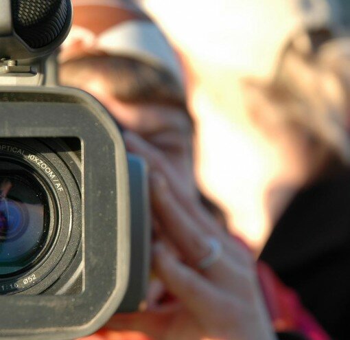Women with video marketing camera